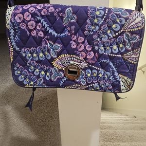 Vera Bradley crossbody with purple, pink and blue flowers on it.
